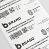 Security Label 100x50mm matte-white with "VOID OPEN" tampering and black custom print